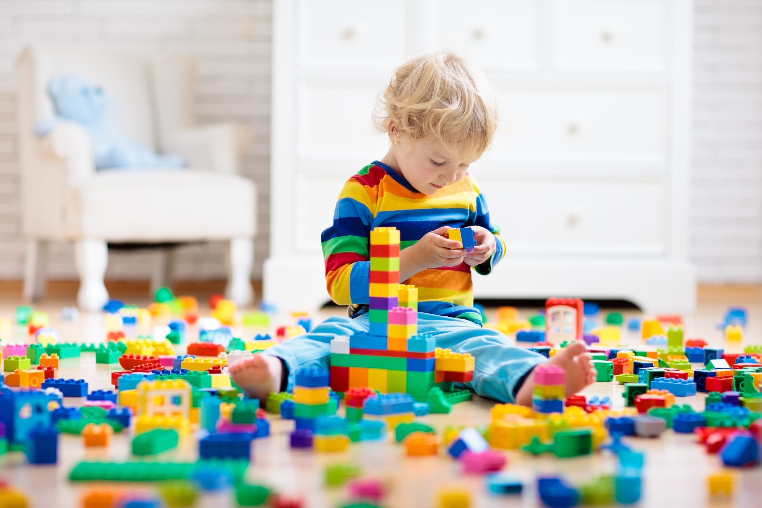 Child,Playing,With,Colorful,Toy,Blocks.,Little,Boy,Building,Tower